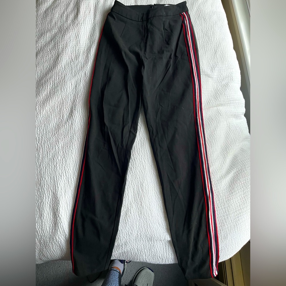 Black pull on pants with pin stripe. Zipper in the back.